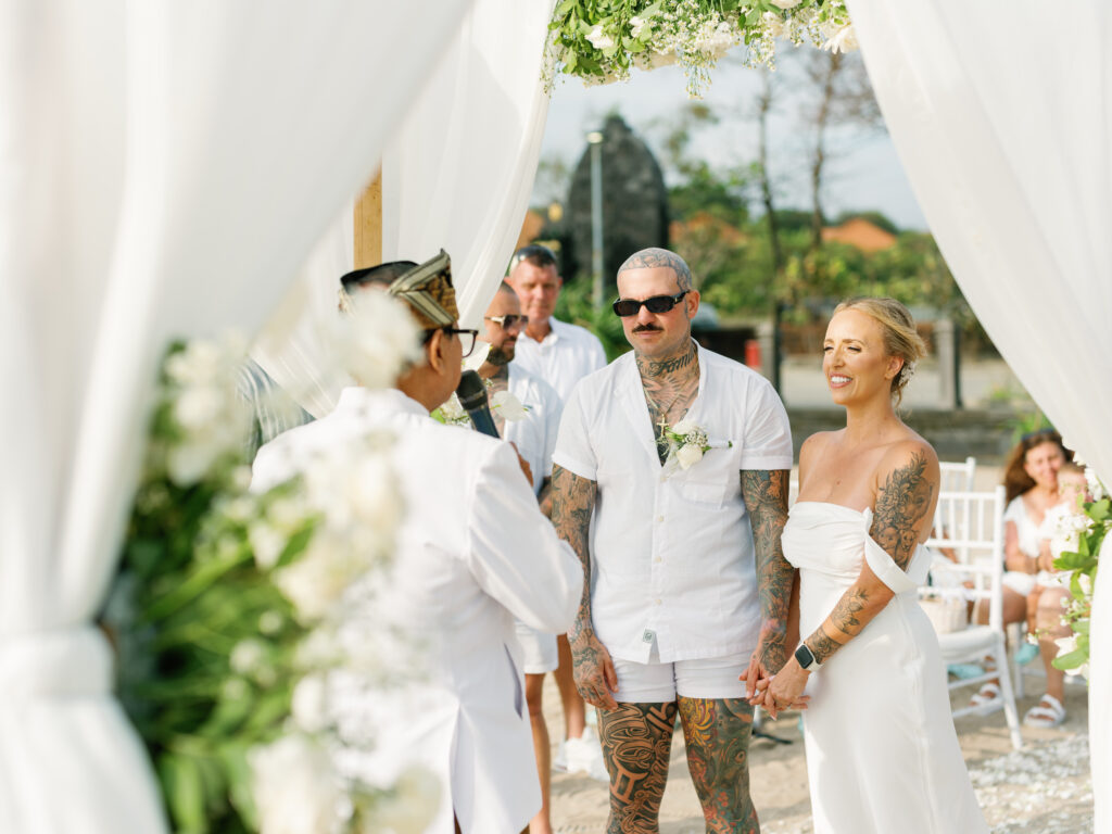 bali elopement wedding ceremony couple with officiant intimate beach wedding