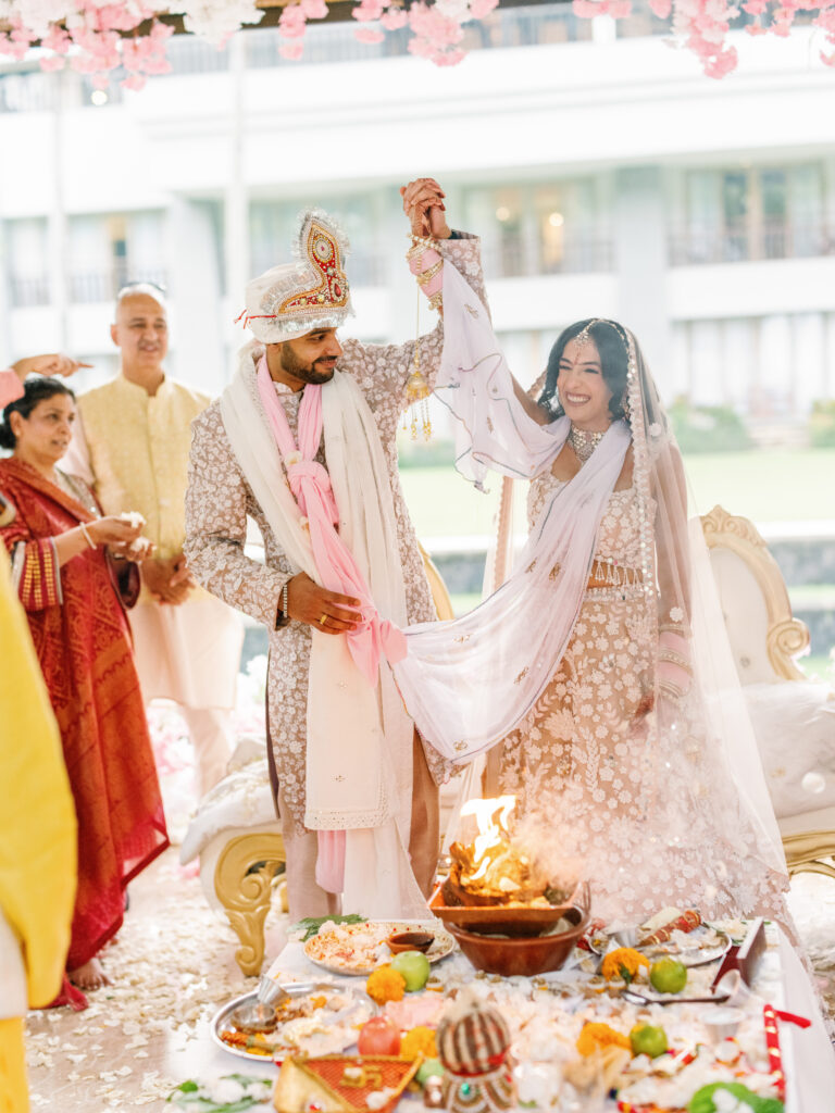Indian wedding ceremony at Conrad Bali – bride and groom celebrating ritual moment in a luxury Bali destination wedding