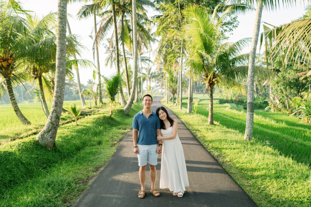 bali couple photoshoot tibumana waterfall palm trees road ubud couple portrait