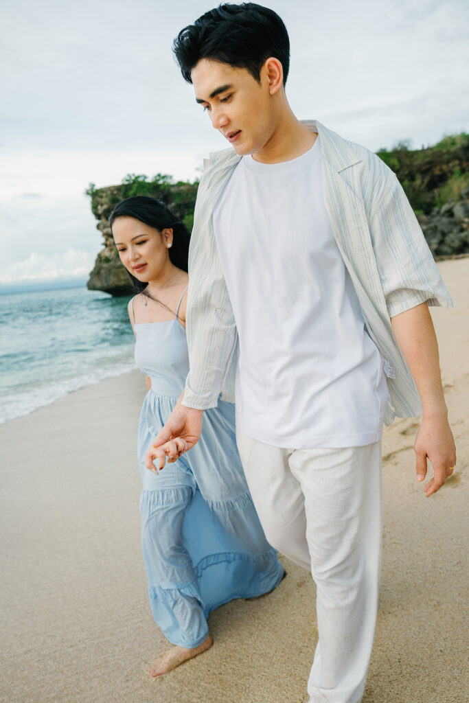 Sunset couple session Uluwatu Bali intimate moment beach soft light