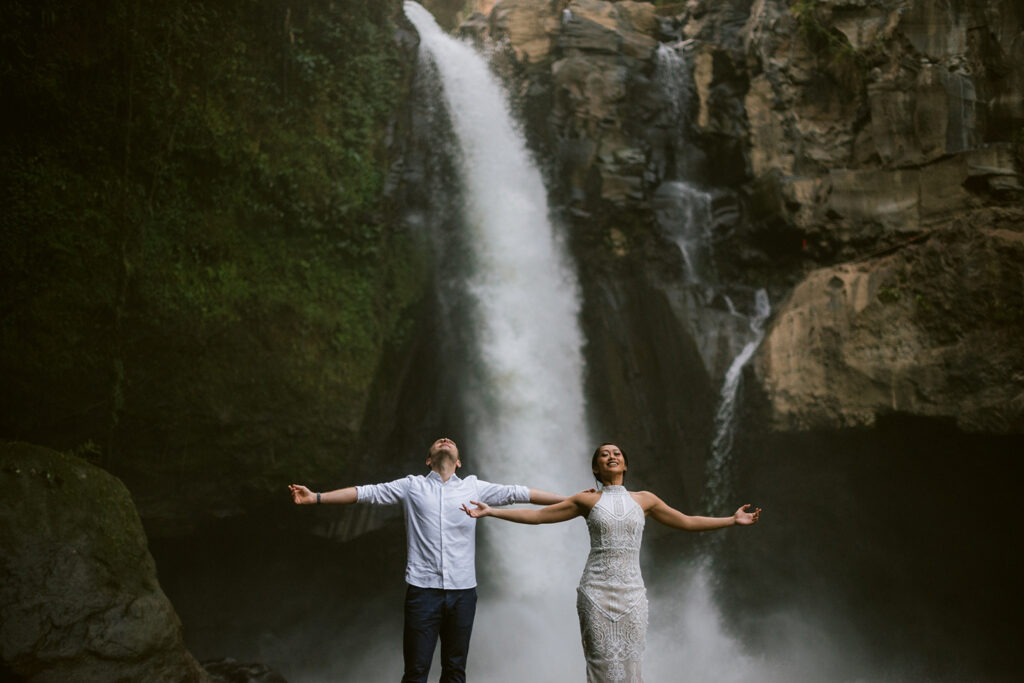 Ubud couple photoshoot Bali waterfall dramatic natural light jungle
