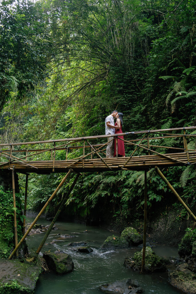 Ubud couple photoshoot Bali bamboo bridge jungle river valley intimate