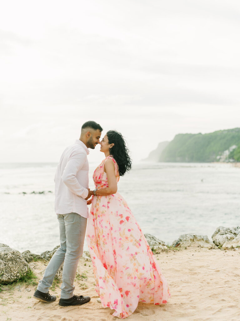 Pre-wedding photoshoot Bali Pandawa beach floral dress cliff backdrop
