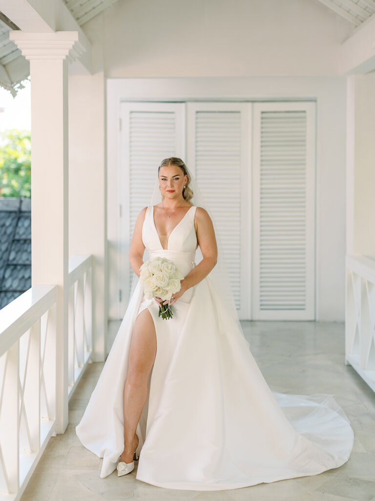 intimate villa wedding in Bali bride portrait with elegant dress and natural lig