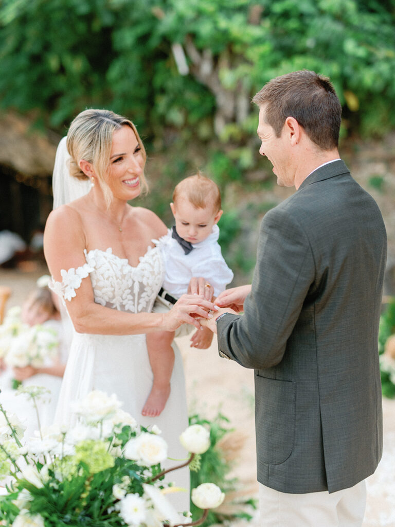 samabe bali elopement with family ring exchange ceremony with baby intimate wedding moment