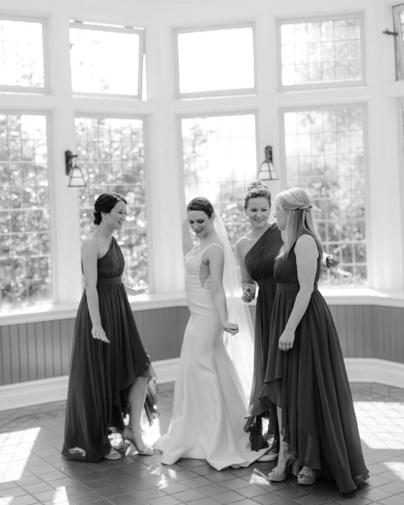 Organic getting-ready moment — bride with bridesmaids at Cecil Green Park House Vancouver, documentary approach letting real moments unfold naturally