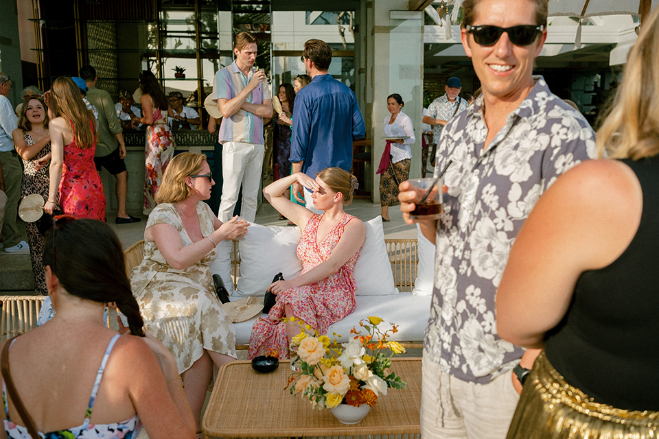 intimate wedding cocktail hour in Bali guests relaxing and socializing at Villa Vedas with tropical outdoor setting and drinks