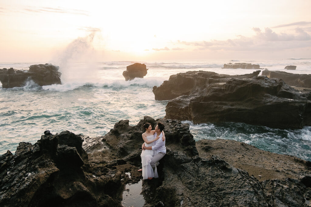 Pre-wedding photoshoot Bali cliffside sunset dramatic ocean waves