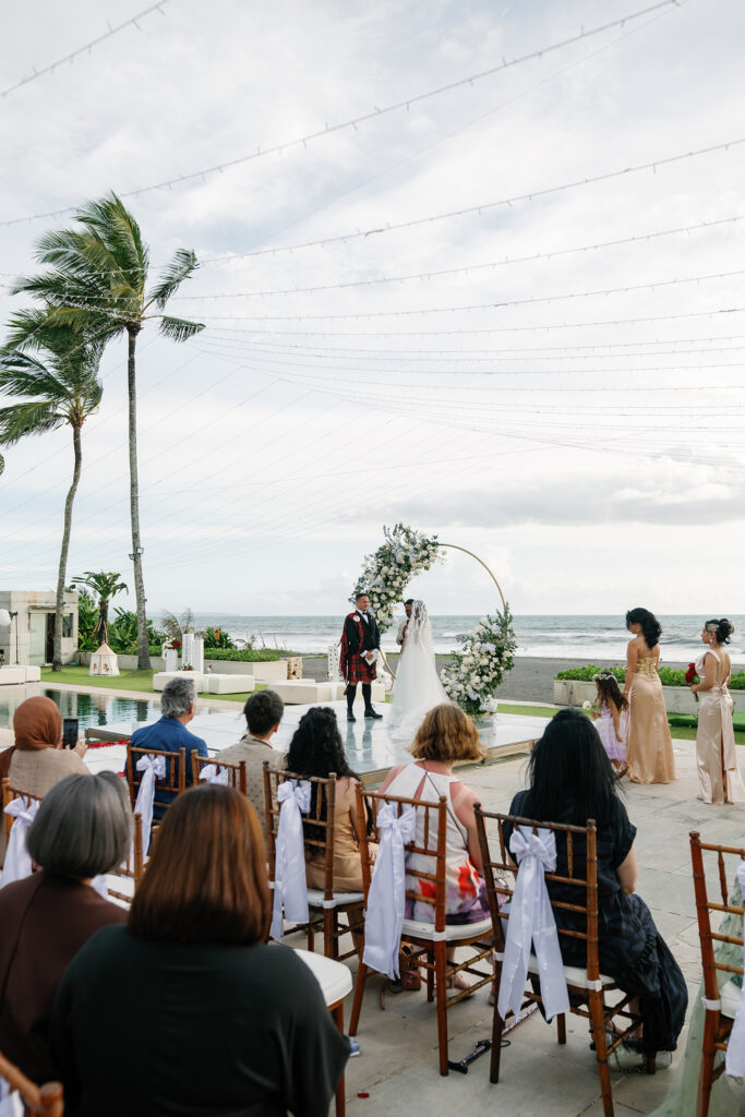 luxury multicultural wedding in Bali at Villa Vedas outdoor ceremony with ocean view