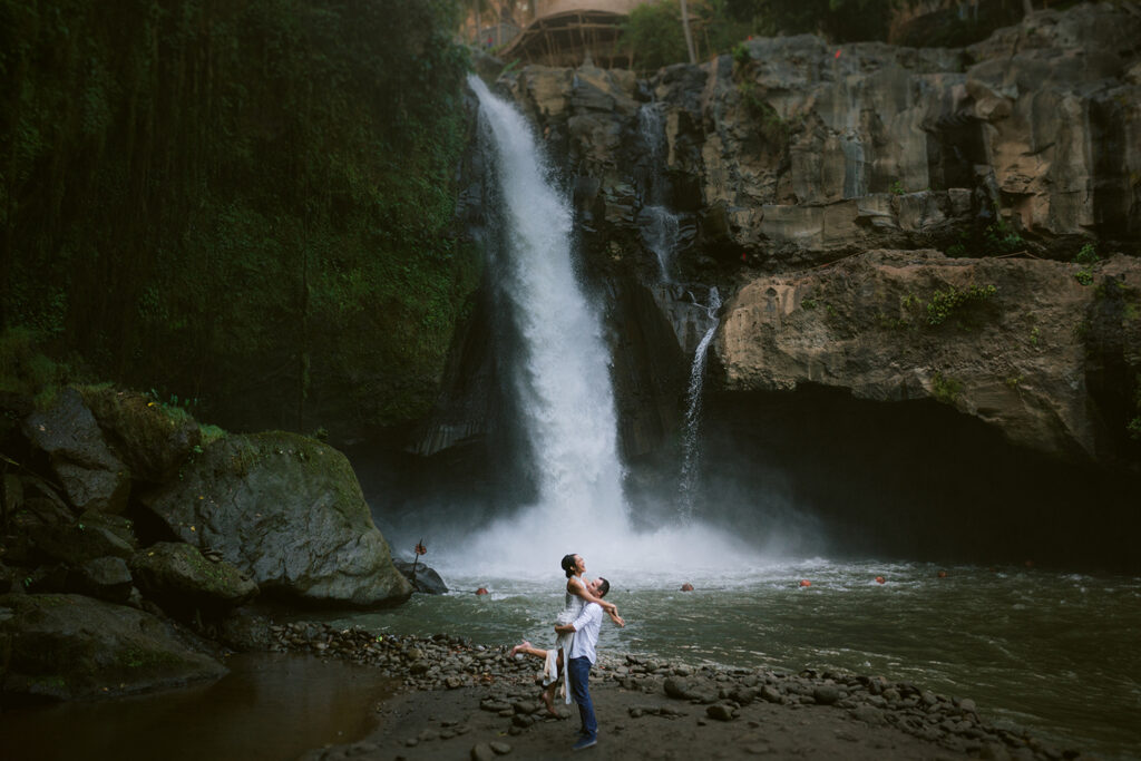 Pre-wedding photoshoot Bali Tegenungan waterfall couple intimate moment