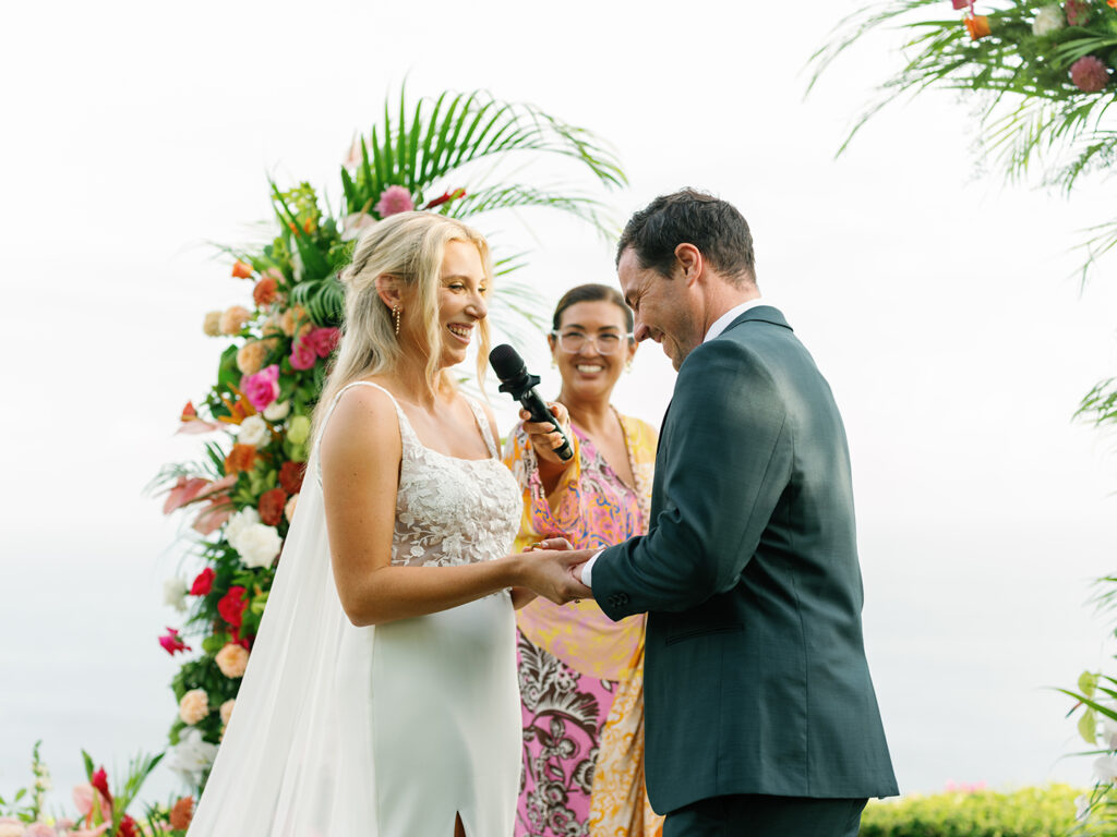 Wonderland Uluwatu wedding vow exchange with bride and groom during ceremony in Bali