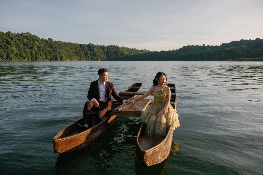 Pre-wedding photoshoot Bali lake Tamblingan wooden boat editorial style