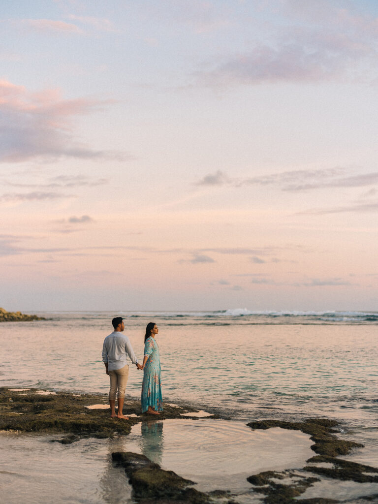 Sunset couple session Uluwatu Bali beach reflection white dress