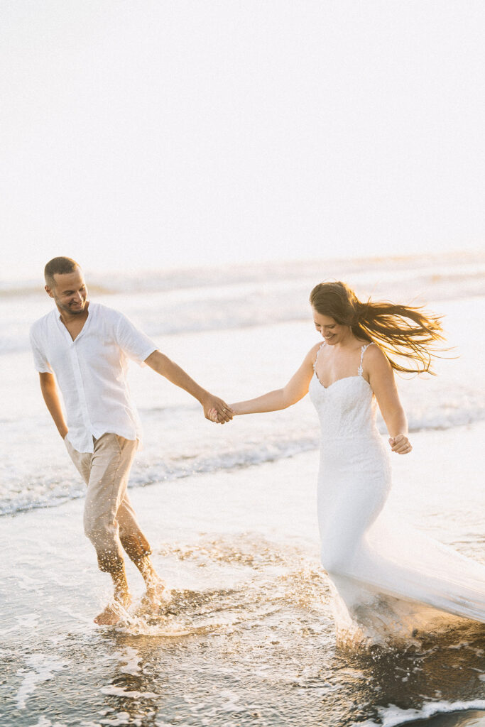 Canggu couple photoshoot Bali beach running waves golden hour natural