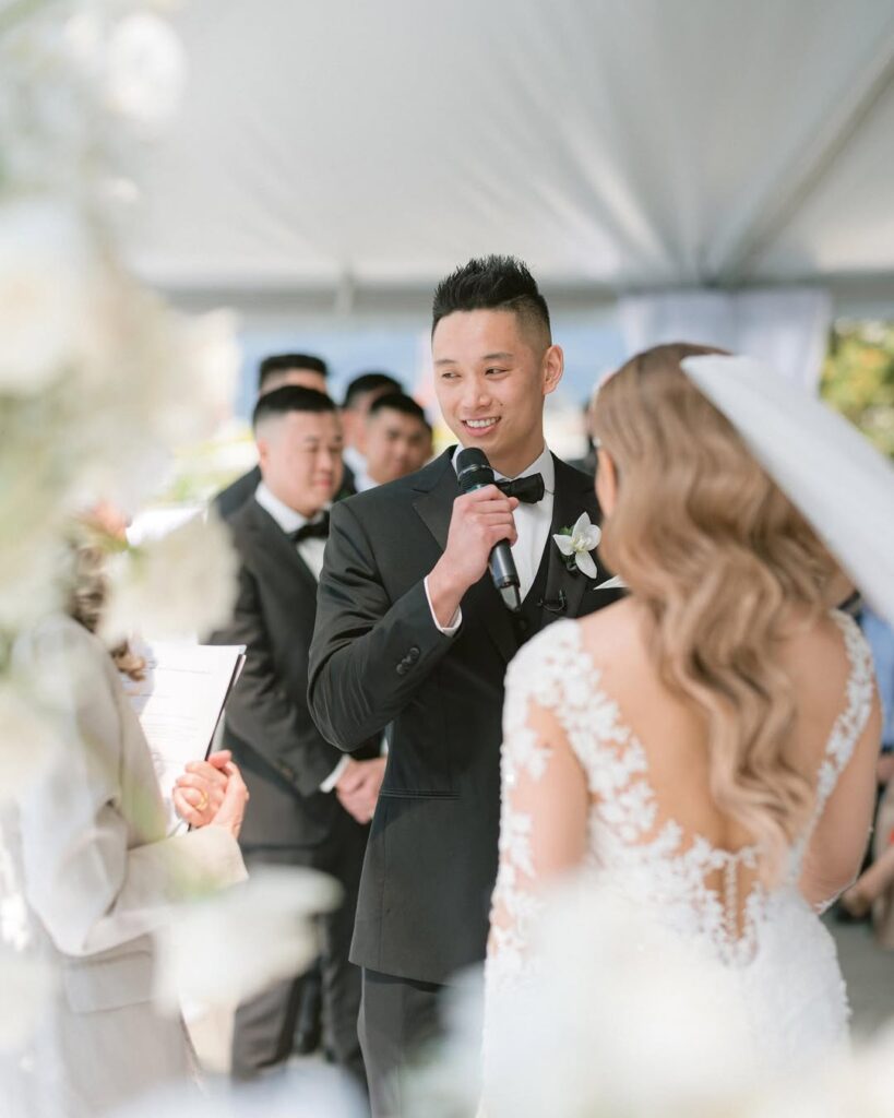 Adam reading vows to Caroline during Science World wedding ceremony Vancouver