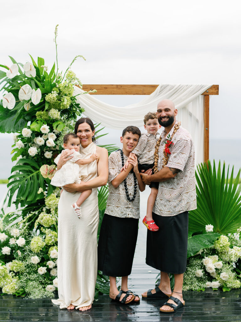 Lauren Dan wedding in Uluwatu Bali family moment at Pandawa Cliff ceremony with children and intimate atmosphere