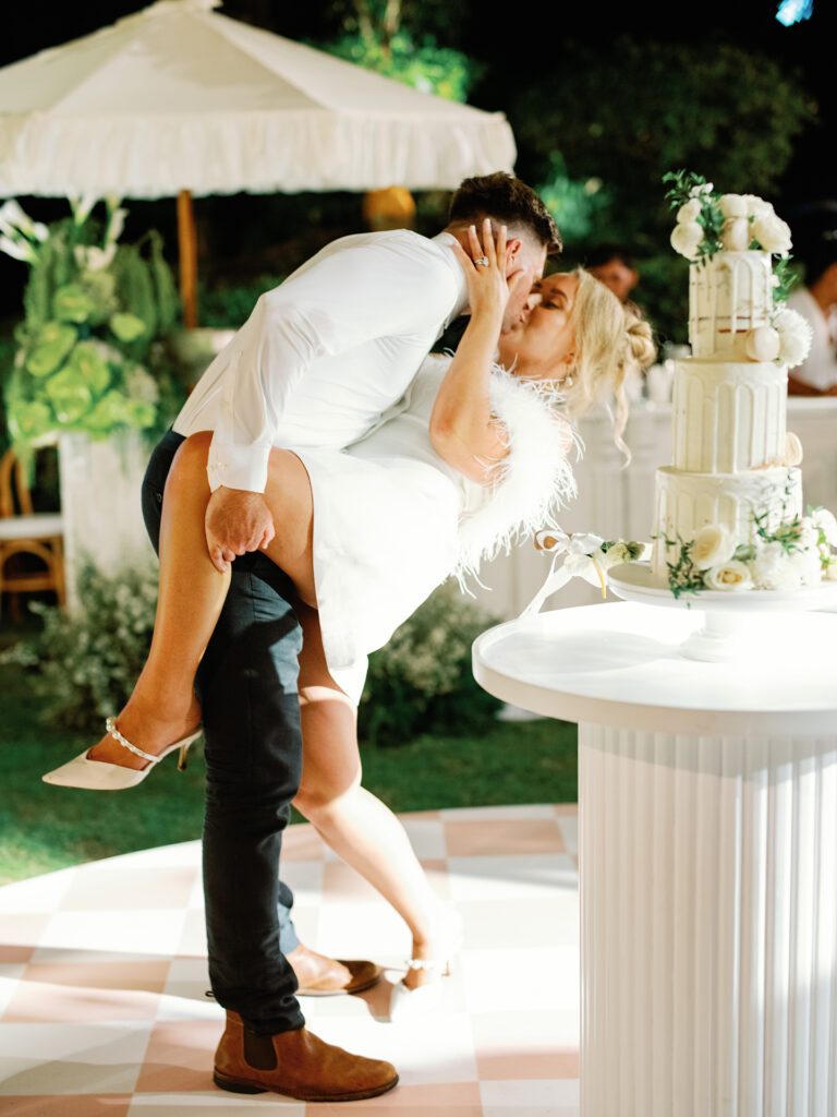 bali wedding photo video package couple kiss cake cutting reception luxima