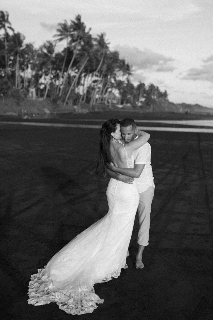 Pre-wedding photoshoot Bali black sand beach wedding dress black white