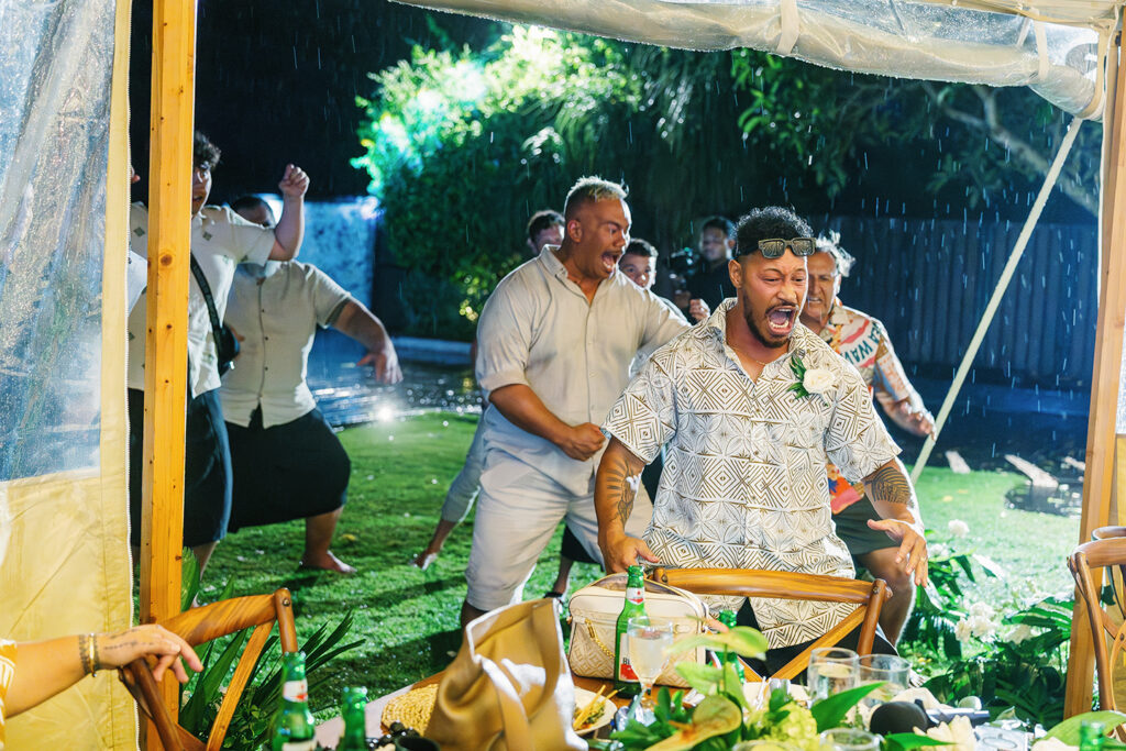 Lauren Dan wedding in Uluwatu Bali haka dance in the rain at Pandawa Cliff during reception celebration