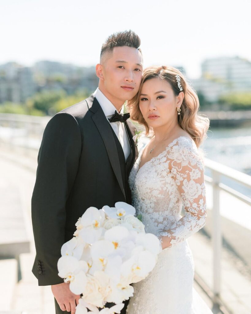 Caroline and Adam wedding portrait at Science World Vancouver waterfront, white orchid bouquet