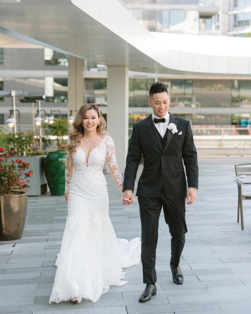 Science World wedding Vancouver — Caroline and Adam walking on rooftop terrace