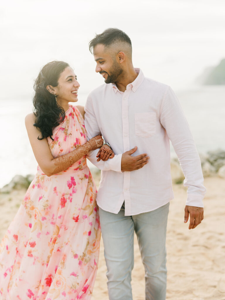 Sunset couple session Uluwatu Bali beach walk candid natural moment