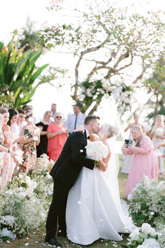 best time to get married in bali june july peak season ceremony couple kiss outdoor wedding bali
