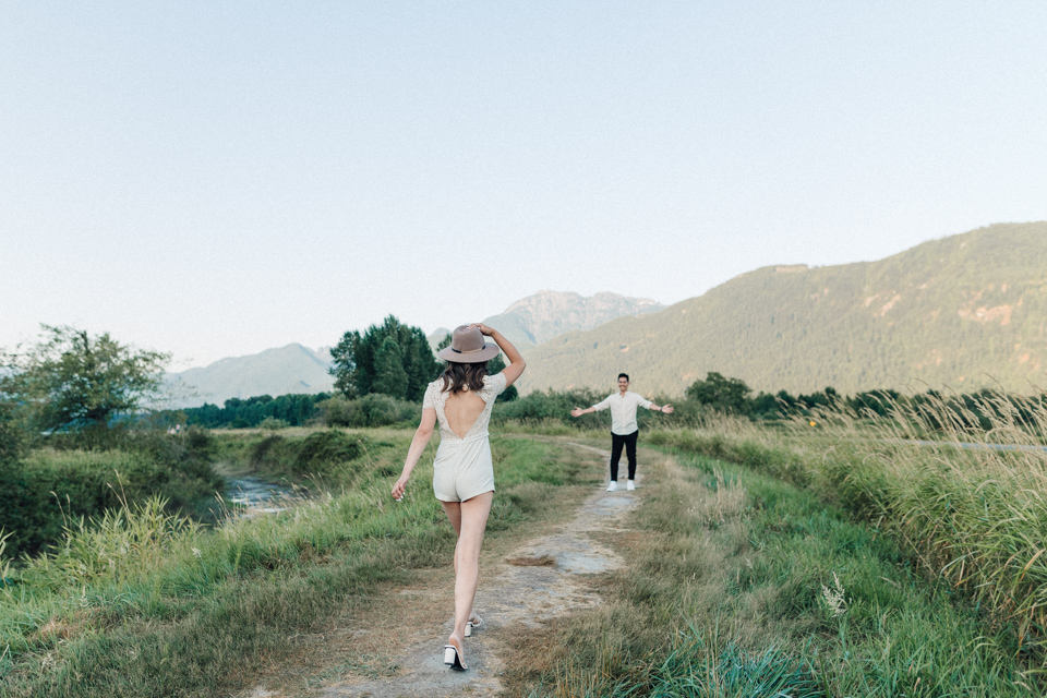 Winnie walking toward Dave on a trail in the Fraser Valley — candid moment