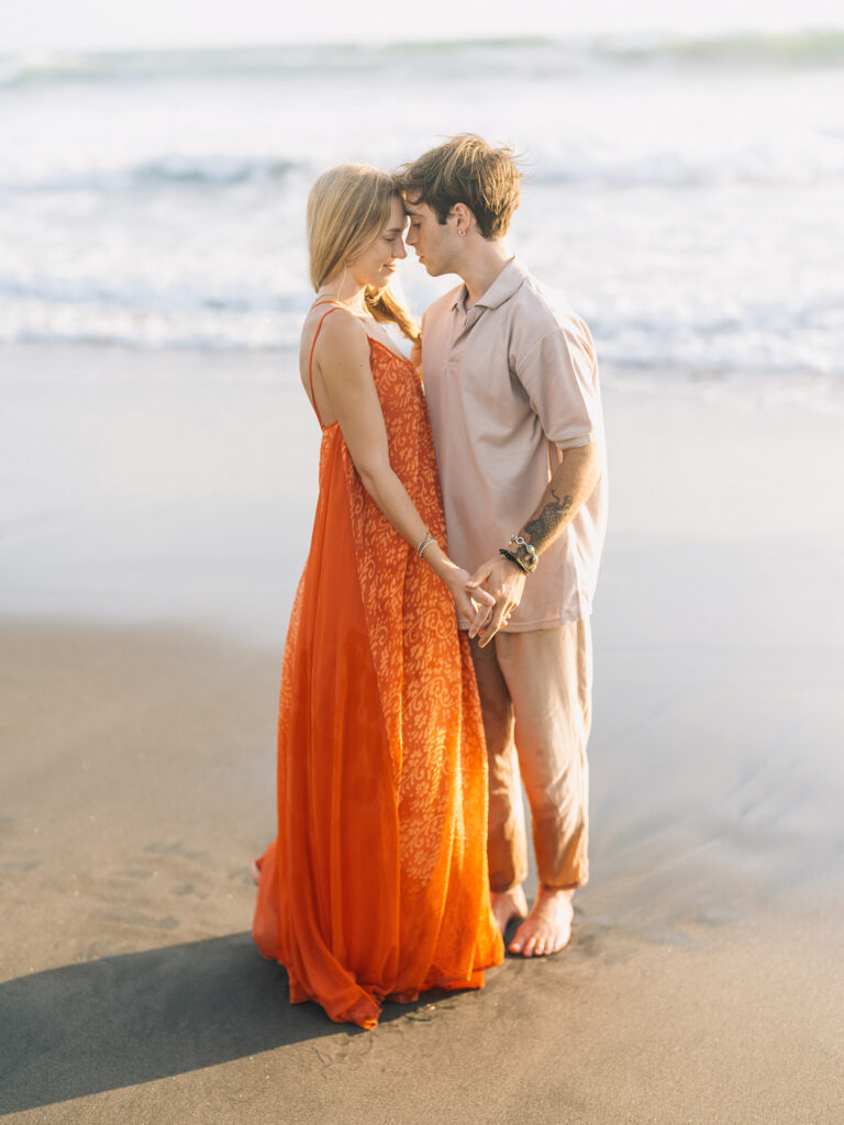 romantic couple session bali kira conor elegant moment at nyanyi beach with soft light