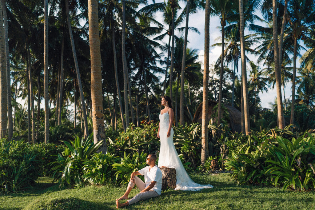 bali couple photoshoot in tropical garden with palm trees and natural editorial style