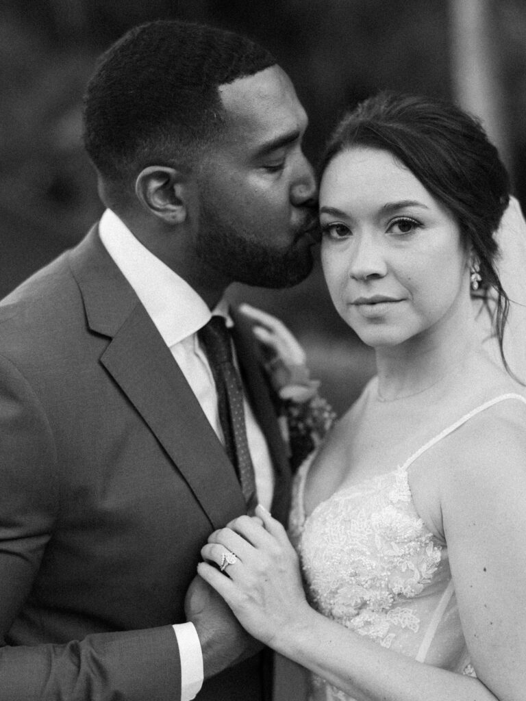 Intimate Ubud elopement couple portrait at Jannata Resort Bali with groom kissing bride