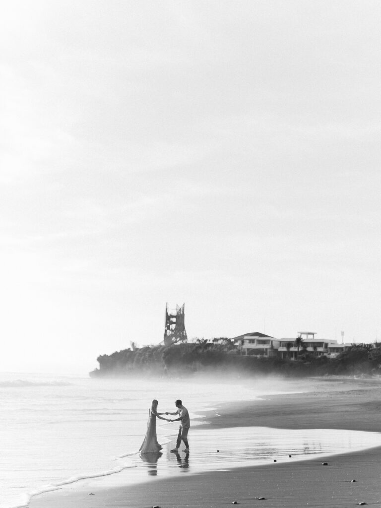 romantic couple session bali kira conor cinematic wide black and white beach moment