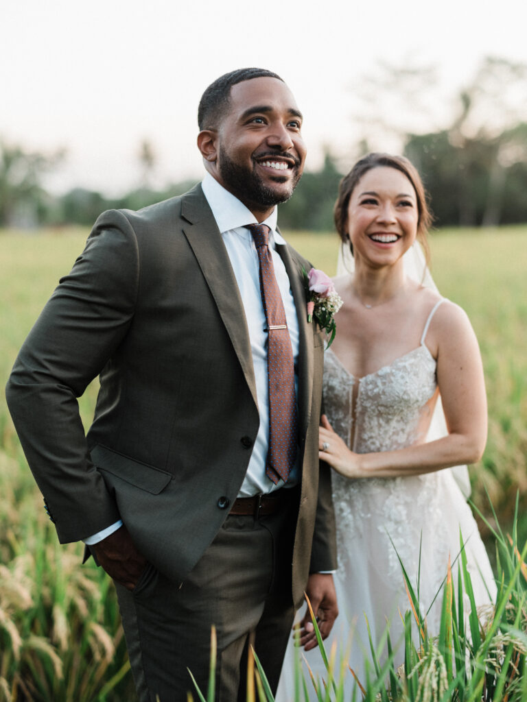 Happy Ubud elopement couple in Bali rice field enjoying intimate wedding moment