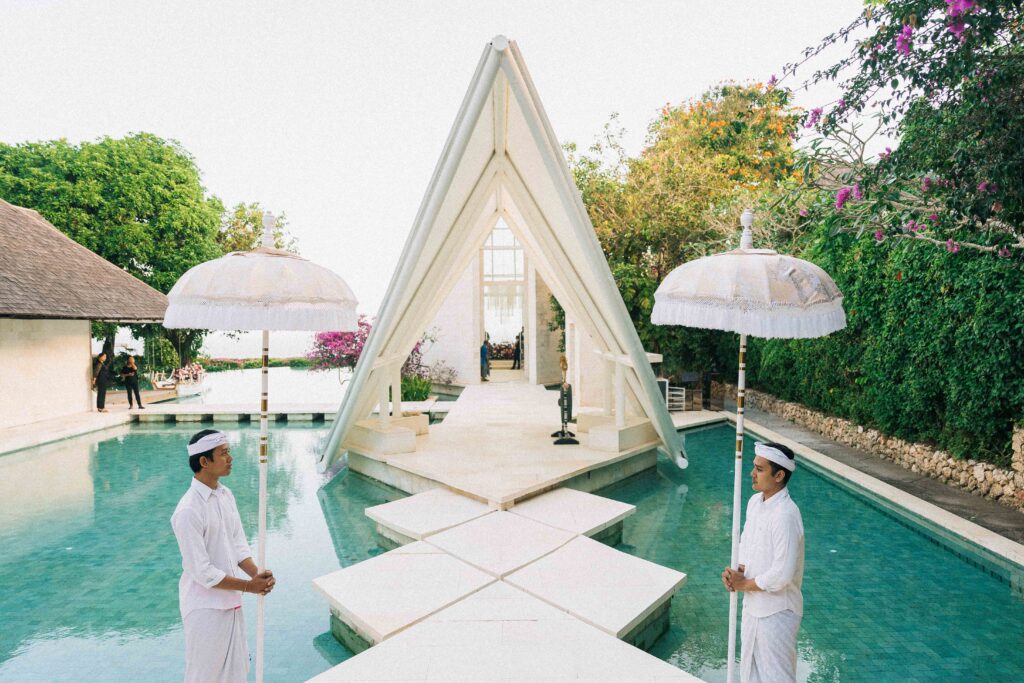 tirtha uluwatu wedding glass chapel bali exterior architecture reflecting pool entrance