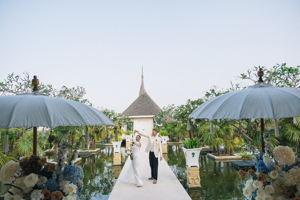 Puri Temple Hill wedding venue walkway with lotus pond and chapel in Jimbaran Bali