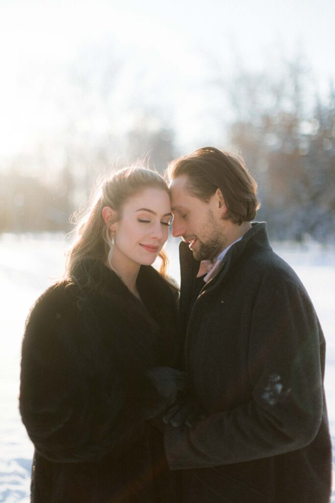 Documentary wedding photographer Bali — intimate winter couple portrait Canada, editorial fine art approach with warmth and movement