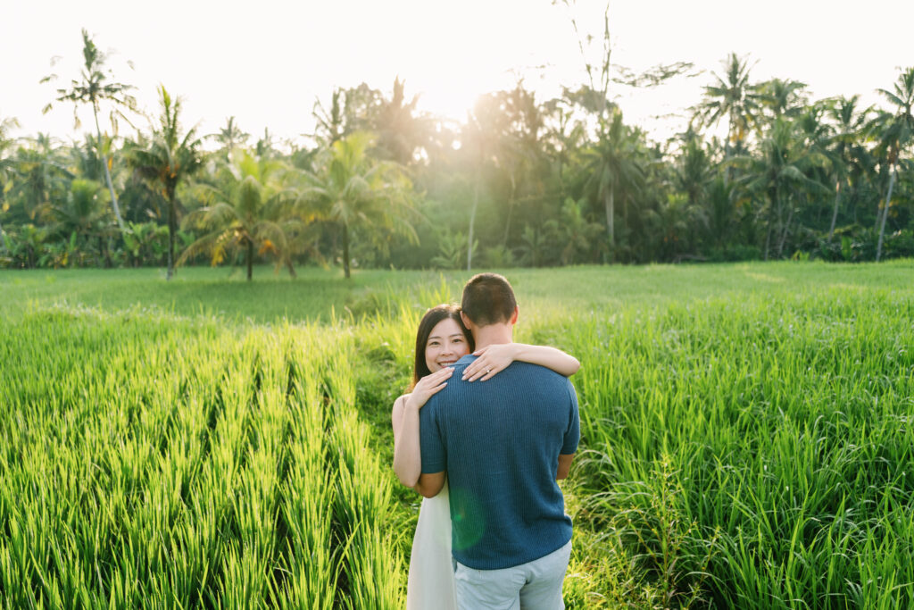 bali couple photoshoot in ubud rice field at sunset with natural candid moment