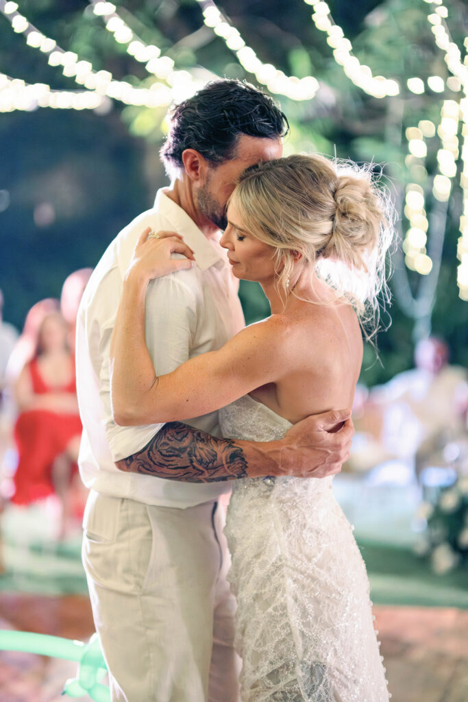 Reception — First dance under fairy lights Alt text: First dance under fairy lights at Nusa Dua Beach Hotel wedding reception Bali — documentary wedding photography by Luxima Wedding