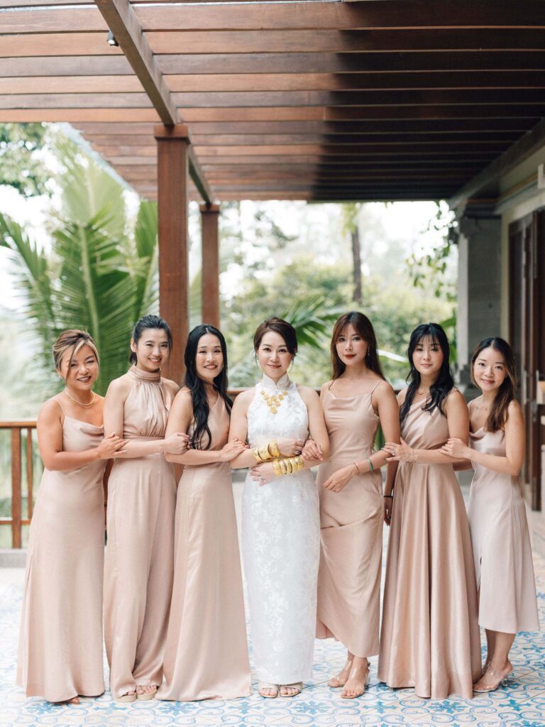 Chinese bride in white qipao with gold jewellery and bridesmaids at Padma Resort Ubud — Chinese tea ceremony Bali wedding