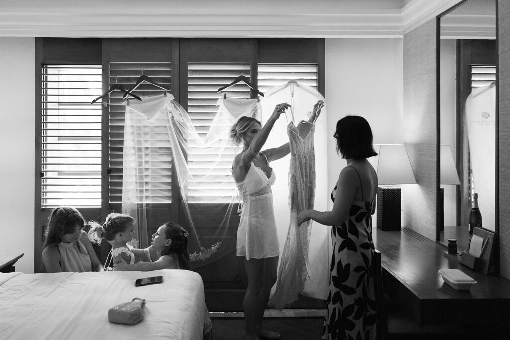 Getting Ready — Bride's room Alt text: Bride getting ready with bridesmaids and flower girl at Nusa Dua Beach Hotel Bali wedding — documentary photography by Luxima Wedding