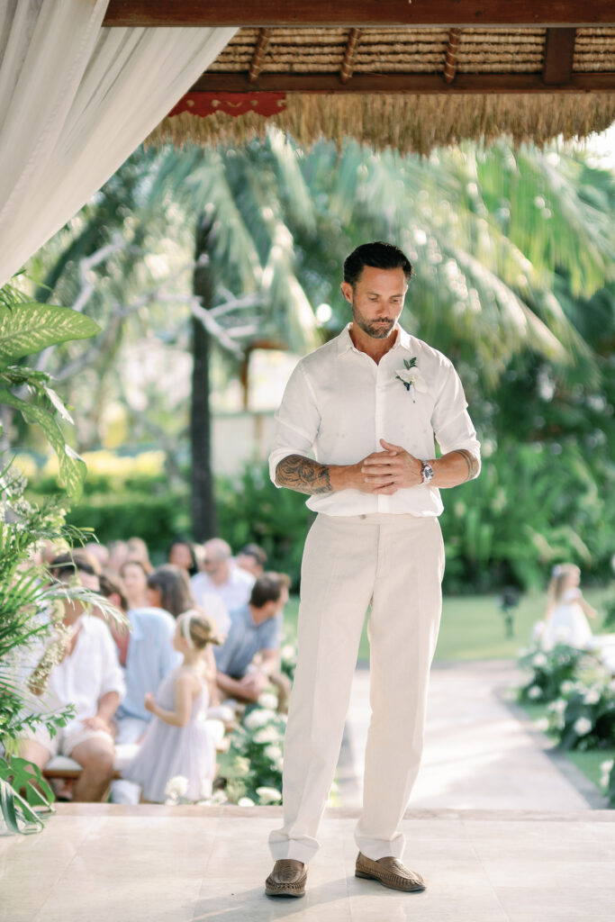 Groom waiting at the altar during a garden wedding ceremony in Bali