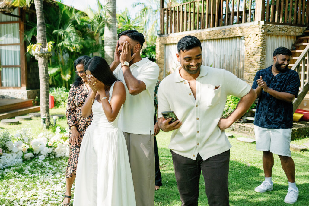 Emotional family reveal during a surprise proposal celebration at Villa Desa Roro Bali