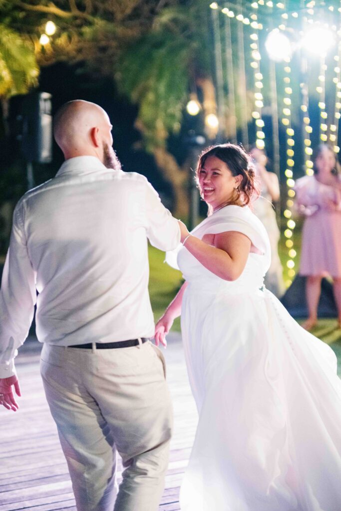 Janela and Jack first dance at Peppers Seminyak Bali wedding reception under string lights