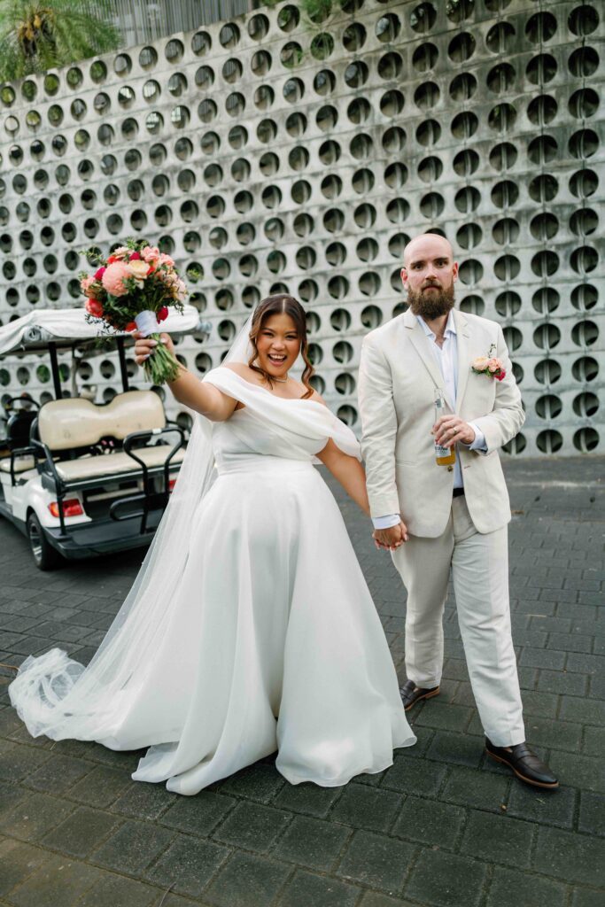 Janela celebrating after ceremony at Peppers Seminyak perforated concrete wall Bali wedding