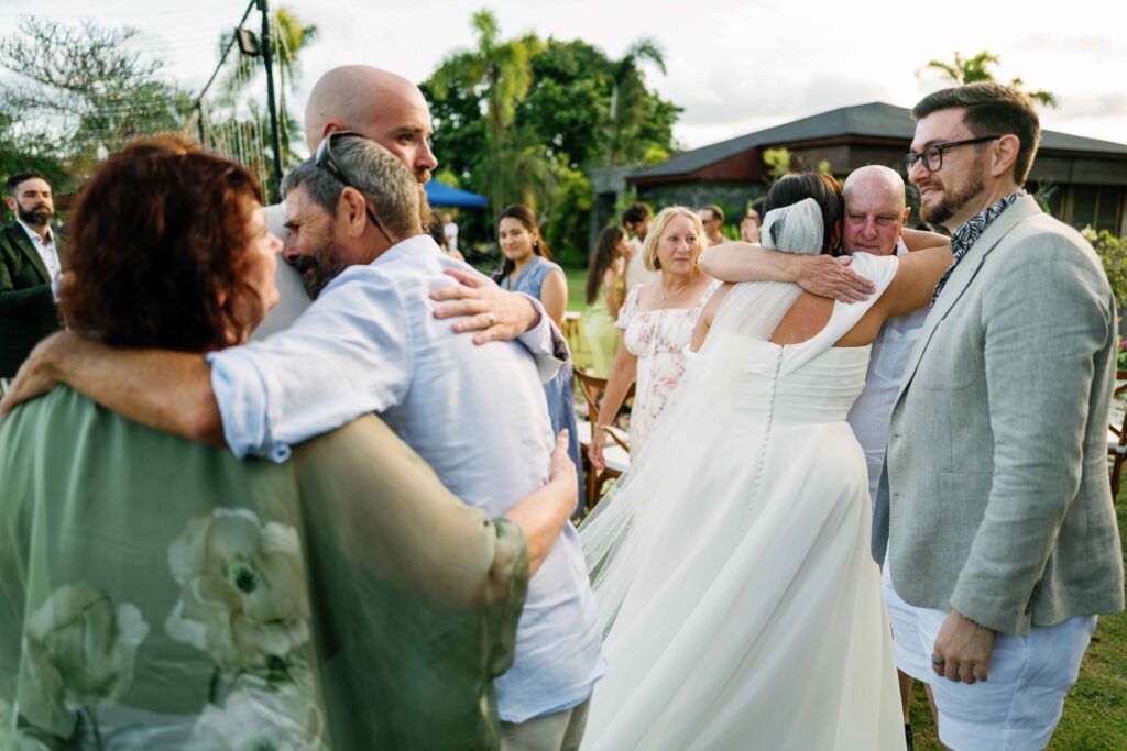 Janela hugging family guests after ceremony at Peppers Seminyak Bali wedding