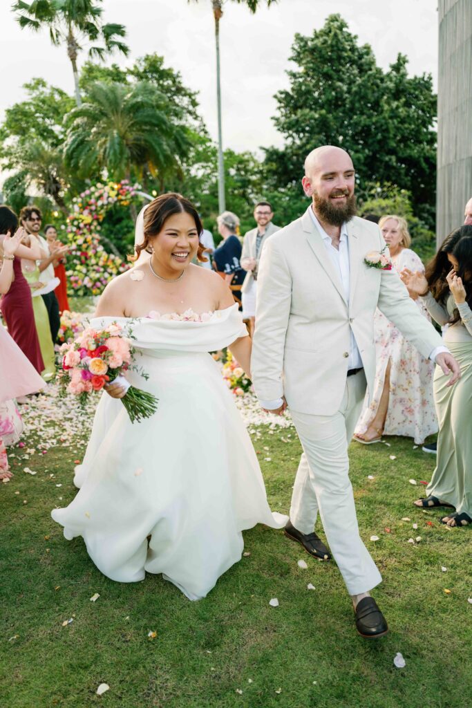 Janela and Jack recessional walk after ceremony at Peppers Seminyak Bali intimate wedding