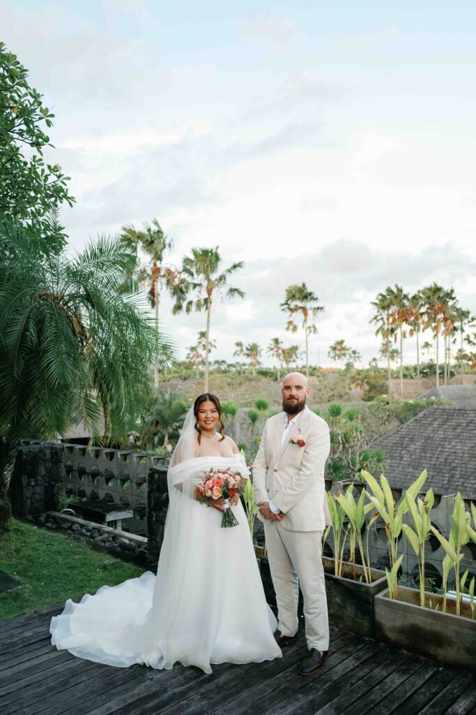 Janela and Jack portrait on rooftop deck at Peppers Seminyak Bali with palm trees