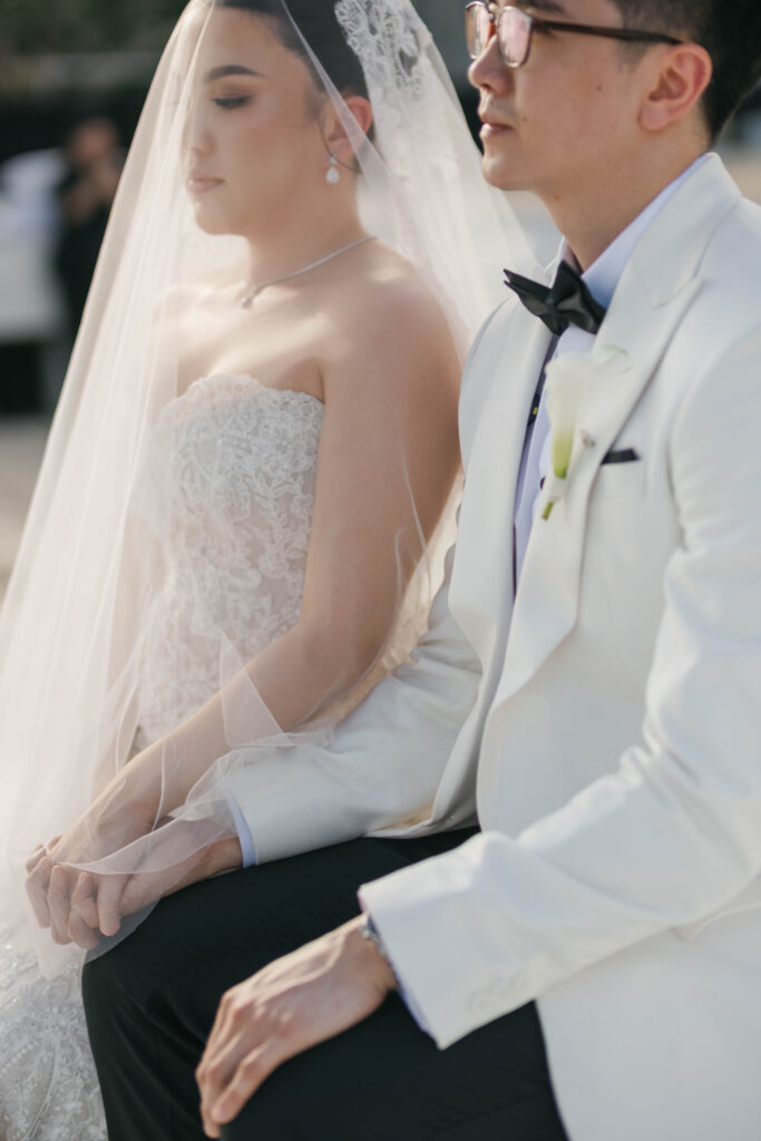 Candid moment of Randy and Michelle sitting quietly together during Villa Plenilunio Uluwatu wedding ceremony — Luxima Wedding